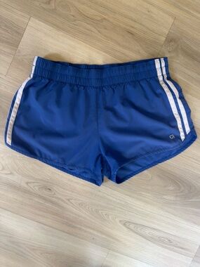 Gap 
Women’s Blue Athletic Running Shorts with White Stripe
Size: Medium